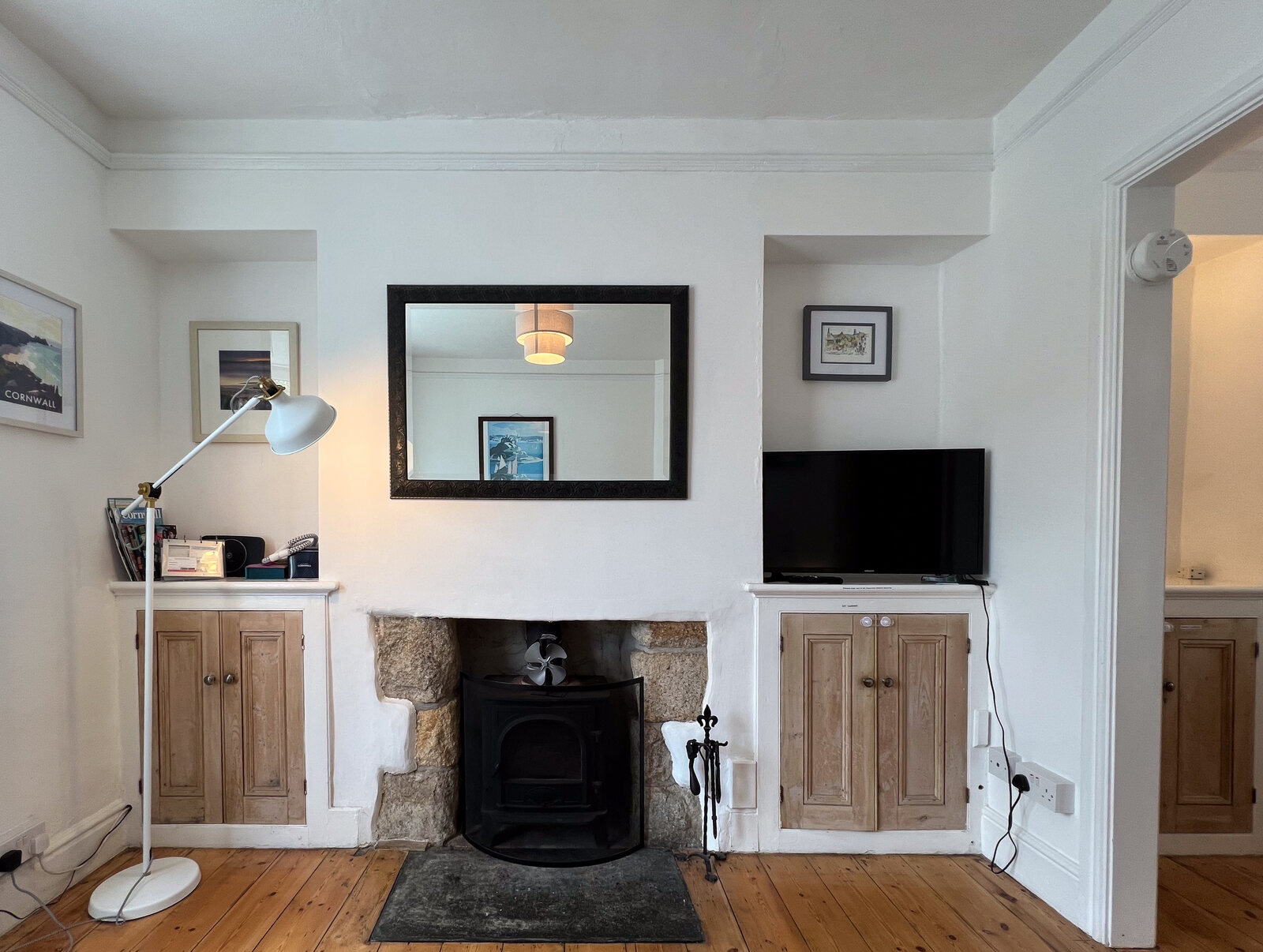 Living room with granite fireplace and wood-burning stove