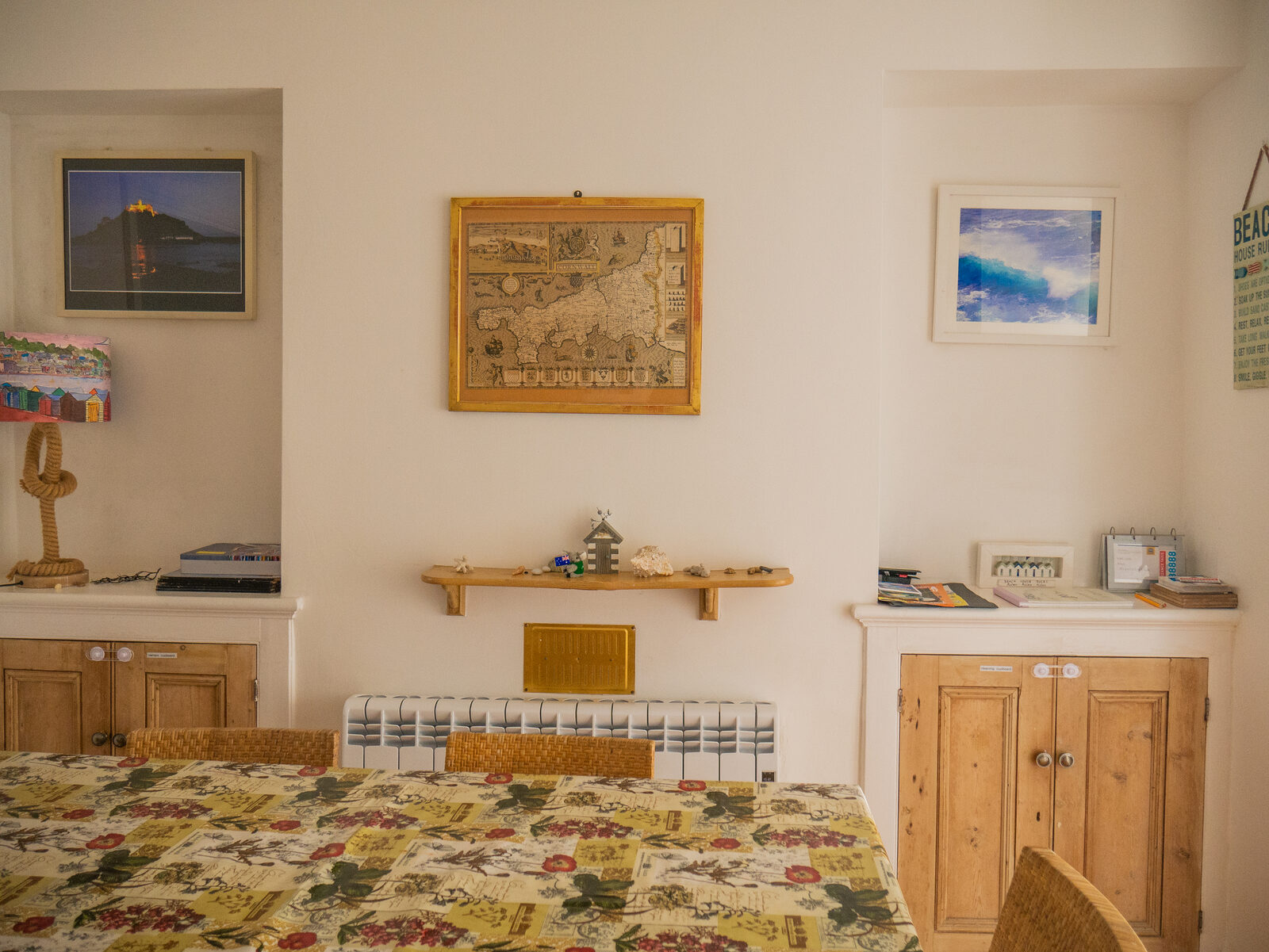 Dining room with a large table and antique Cornwall map