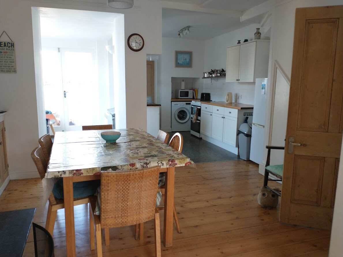 Dining table looking through to the kitchen