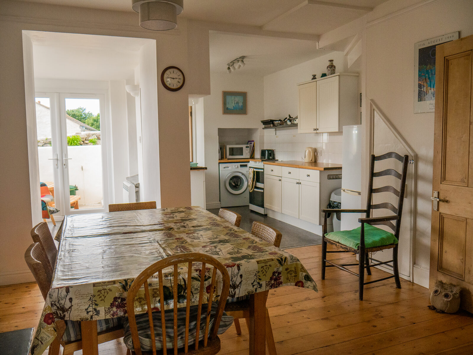 Open-plan kitchen and dining area with wooden floors