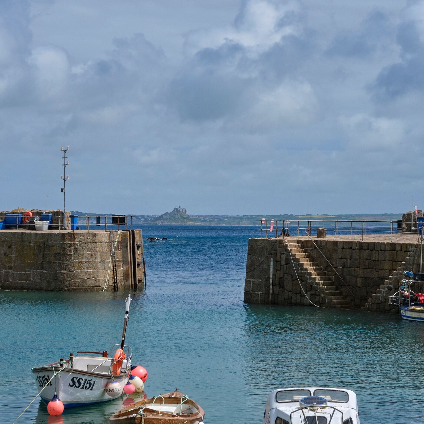 Penzance harbour with fishing boats and St Michael's Mount on the horizon