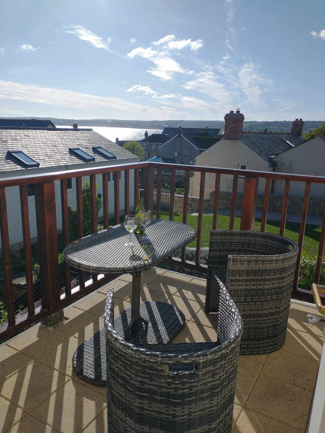 Roof terrace with rattan furniture and views over Mount's Bay
