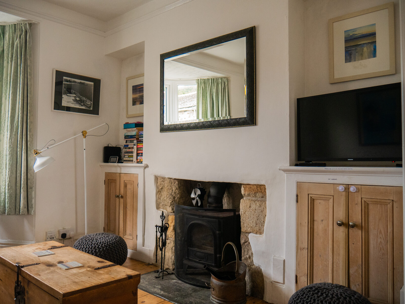 Living room with granite fireplace and wood-burning stove